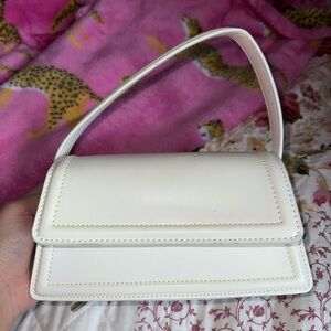 Small white purse with shoulder strap brand new never used